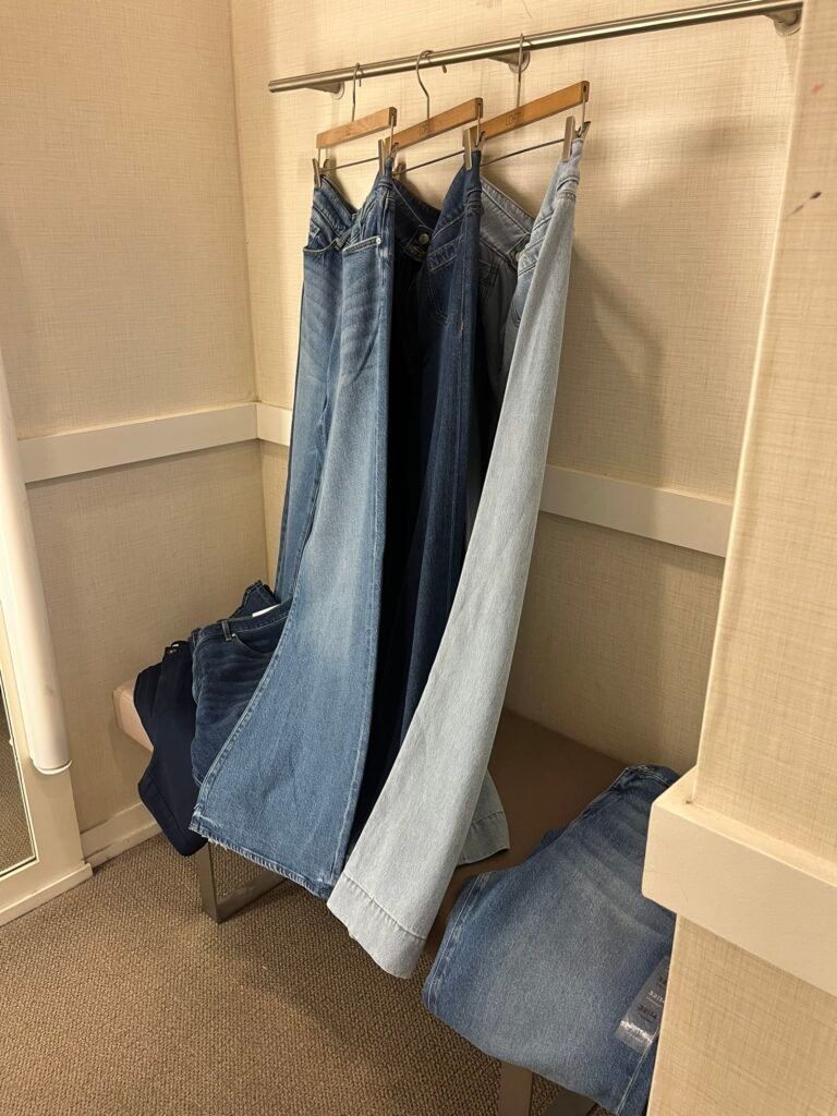 Pic of fitting room with denim styles with various inseams. 